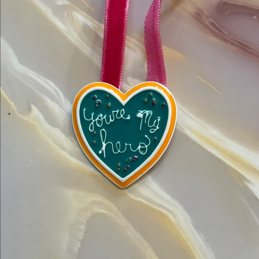 Heart-Shaped Holiday Ornament with Pink Ribbon